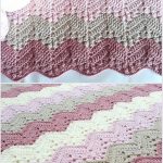 A charming crocheted zigzag pattern blanket in pink, cream, and beige awaits beside balls of yarn. Discover this and other crochet baby blanket patterns free for crafting your own cozy keepsakes.