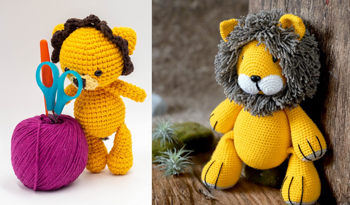 Two charming amigurumi lion toys: one clutching scissors beside a pink yarn ball, and the other boasting a textured mane, sit nestled on a surface adorned with moss and plants.