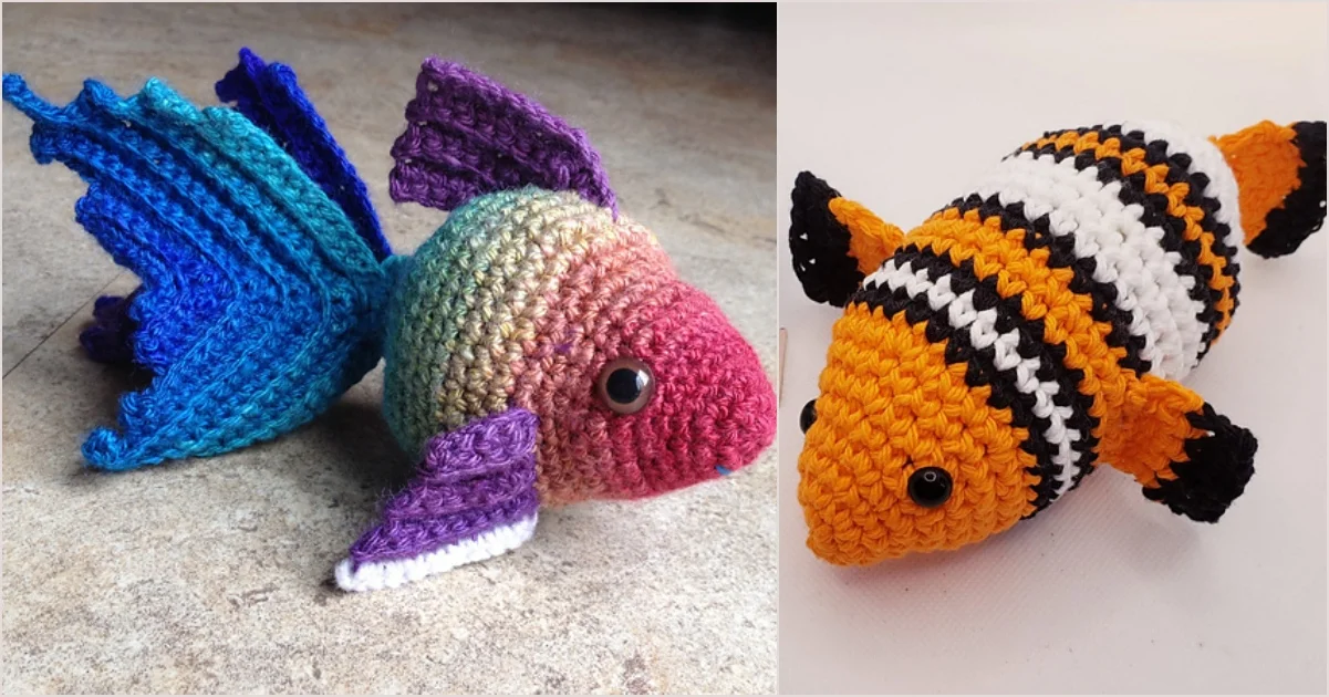 Two crocheted toy fish: one with blue and purple fins and a rainbow body, the other resembling a clownfish with orange, black, and white stripes. Both have black eyes that glimmer like the buttons on cozy chunky slippers.