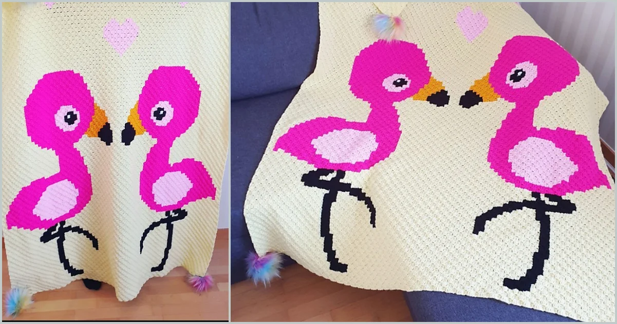 A charming animal c2c blanket showcases two pink flamingos facing each other, with a lovely pink heart above them, elegantly draped over a gray sofa.