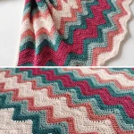crochet baby blanket with a colorful wavy design