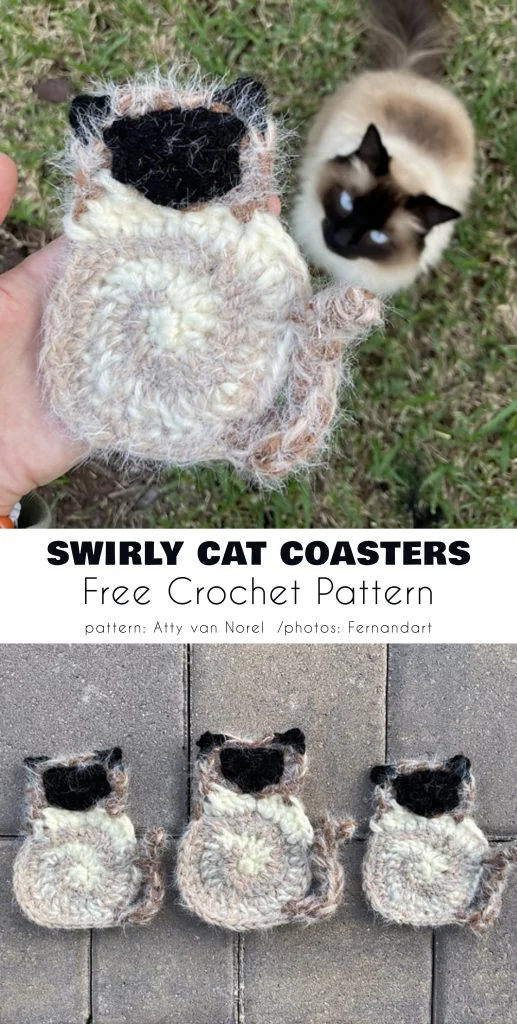 A hand holds an animal coaster, crocheted to resemble a Siamese cat, with a real Siamese cat lounging on the grass. Three similar crocheted animal coasters are neatly displayed in a row below.