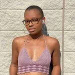 woman wearing light purplr crochet crop top