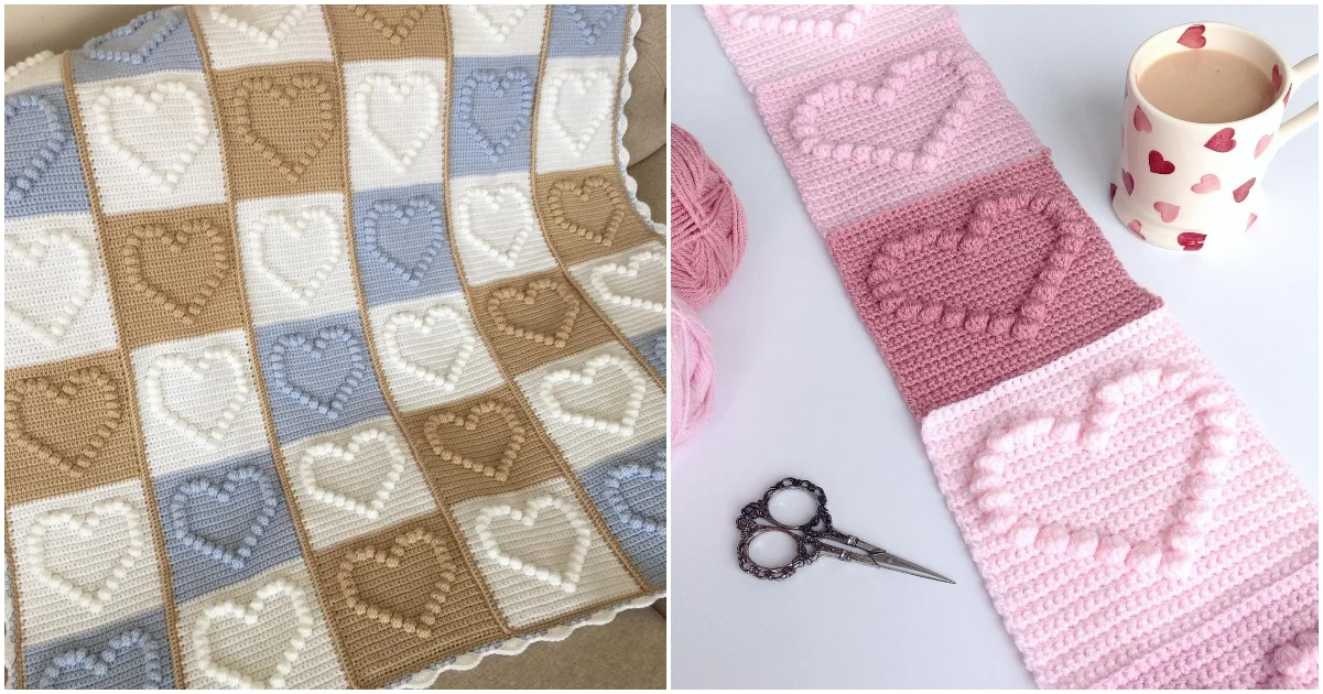 Two beautifully crocheted blankets: one with brown, blue, and white heart patterns that resemble popcorn stitches, and a second featuring pink and white heart designs. A pair of scissors and a mug are nearby.