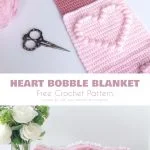Two crochet projects displayed: a pink scarf with heart patterns and a popcorn heart blanket with chevron stripes, beside a heart-patterned mug and a vase of white flowers.