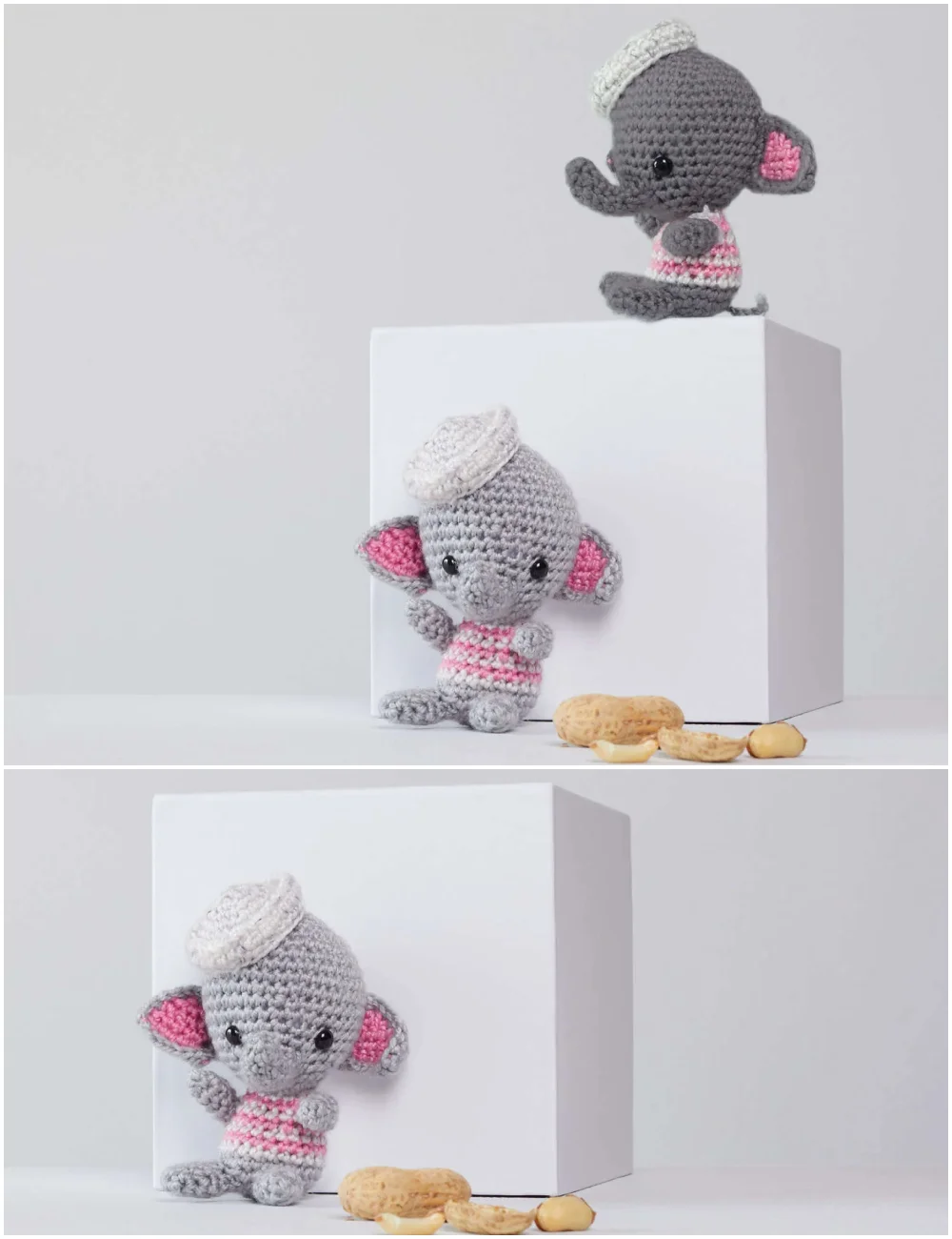 Two crocheted elephant pattern toys in gray, wearing white berets and pink striped shirts, posed with peanuts on and around white cubes.