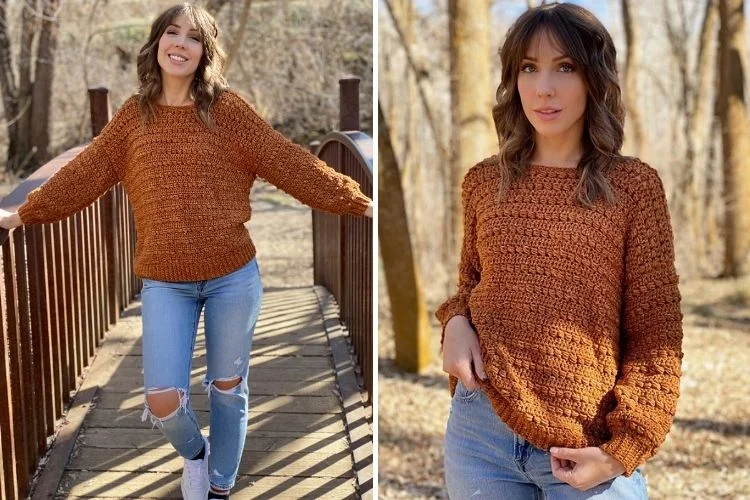 A woman wearing a sweater and jeans on a bridge.