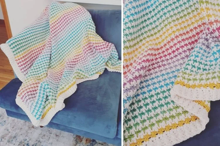 A rainbow crocheted afghan on a couch.