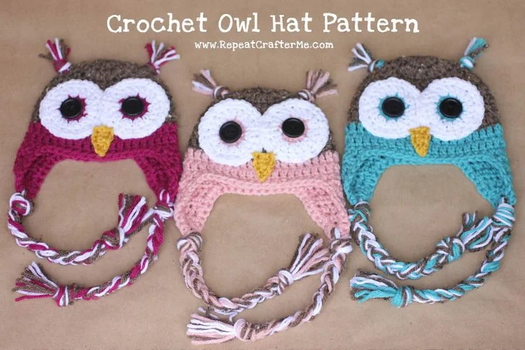 Three crochet owl hats with tassels.