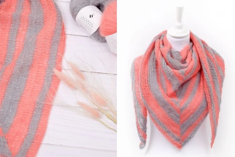 A knitted scarf with a grey and coral pattern.