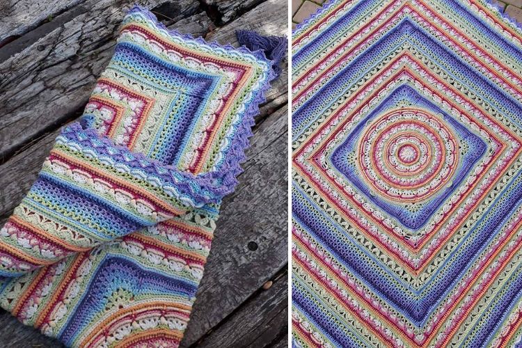 A colorful crocheted afghan on a wooden table.