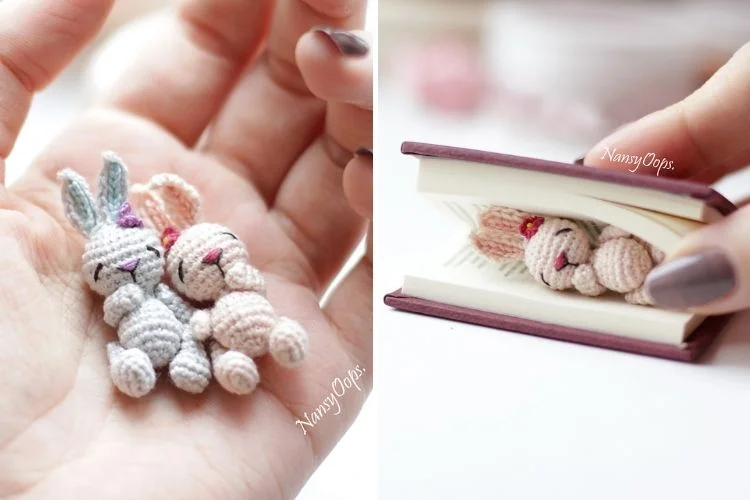 Tiny crocheted bunnies in a book.