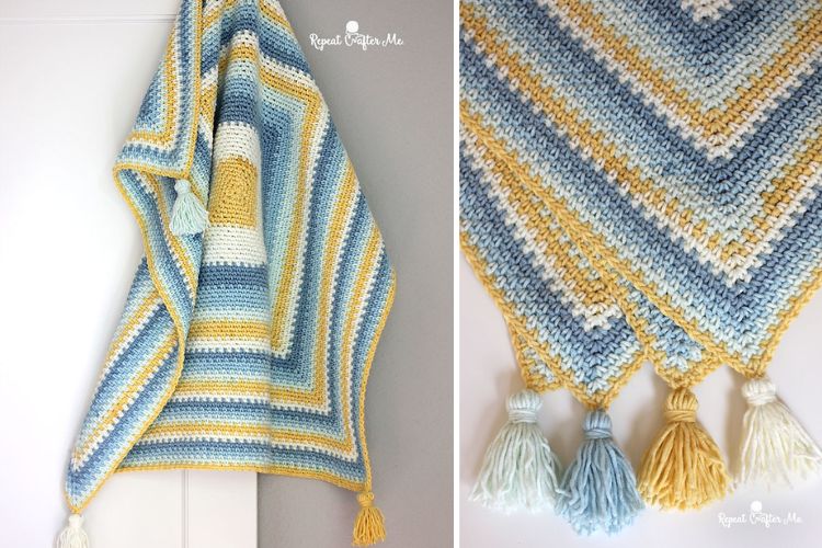 A blue and yellow crocheted blanket with tassels.