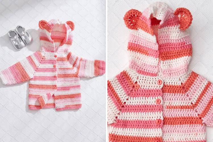 A baby's pink and white crocheted teddy bear cardigan.