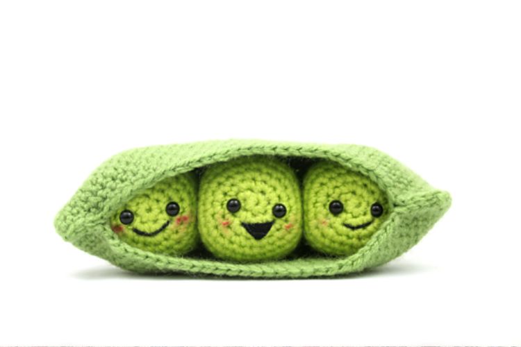 Three crocheted peas in a pod.