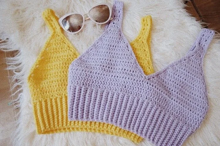 Two crocheted tops with sunglasses on them.