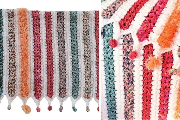 A colorful crocheted blanket with tassels and pom poms.