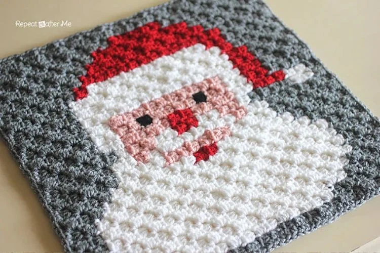 A crocheted santa claus dishcloth.