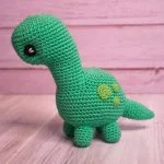 a green crochet brontosaurs amigurumi