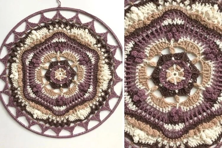 A purple and white crocheted circle hanging on a wall.