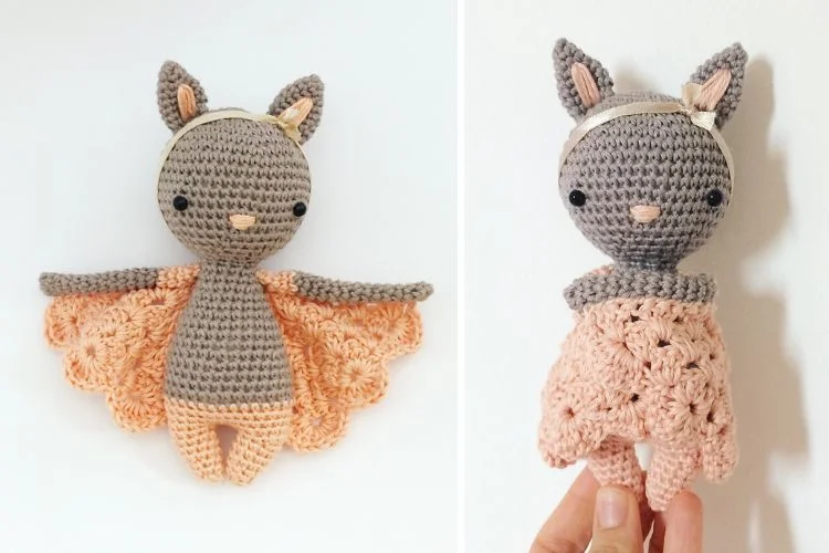 a crochet bat amigurumi with pink wings