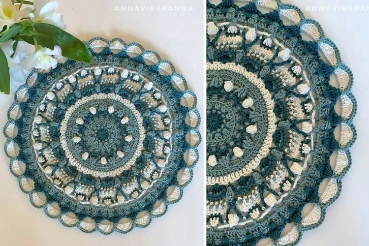 A blue and white crocheted mandala on a table.