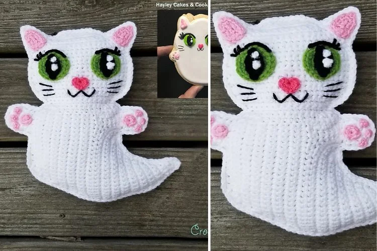 A white crocheted cat with green eyes.