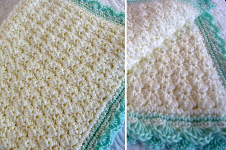 A crocheted afghan with white and turquoise trim.