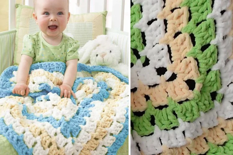 A baby is sitting in a crib with a crocheted blanket.