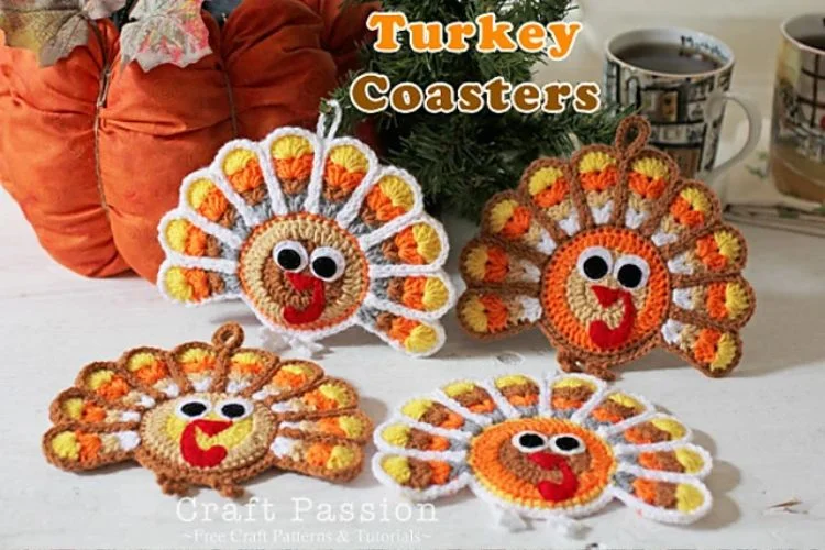 Three crocheted turkey coasters on a table.