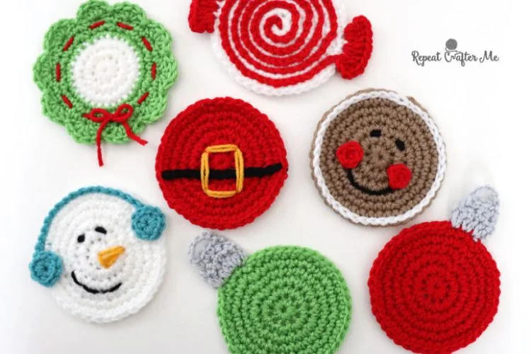 A set of crocheted christmas coasters on a white surface.