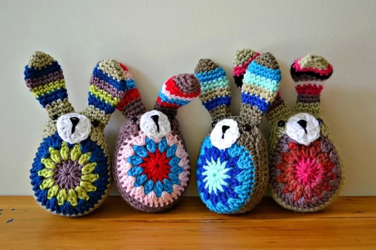 a set of colorful crochet Easter bunny amigurumi