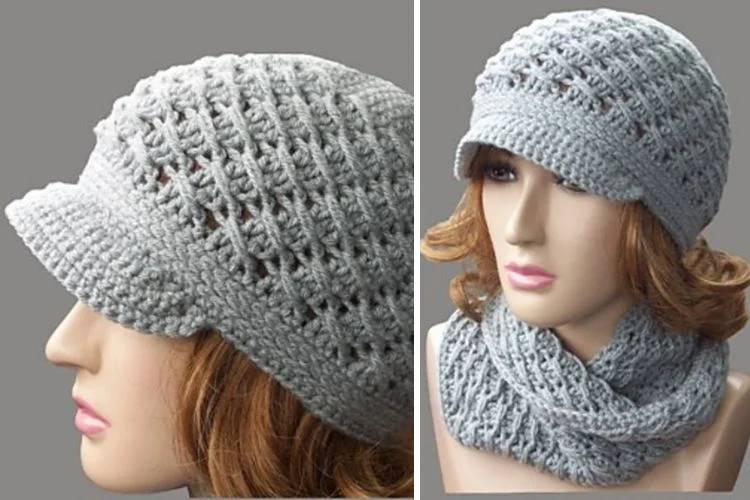 A mannequin wearing a grey crocheted hat and scarf.