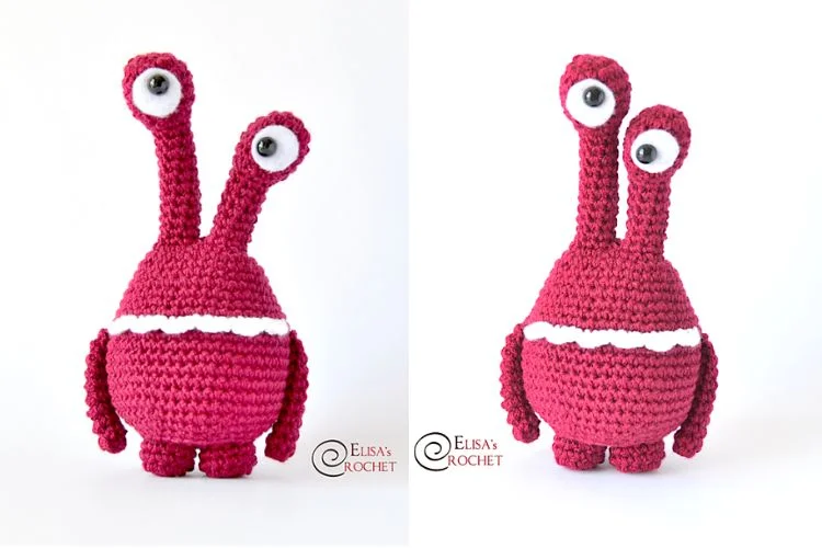 A red crocheted stuffed animal with big eyes.