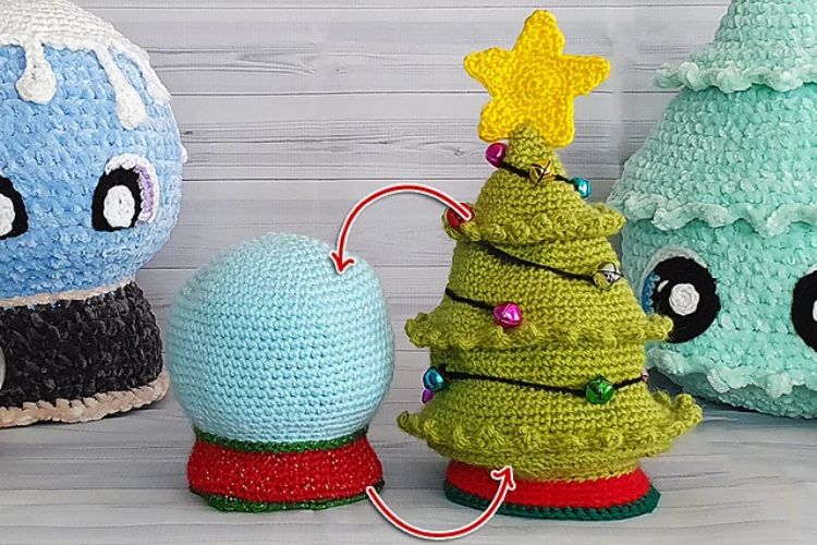 A crocheted christmas tree with a stuffed animal next to it.