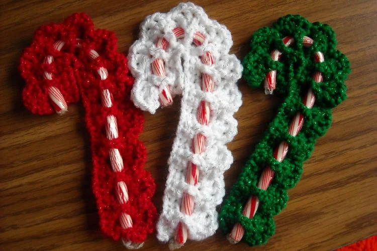 Three Victorian candy canes on a table.