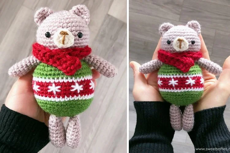 a crochet bear amigurumi with a red scarf and christmas sweater