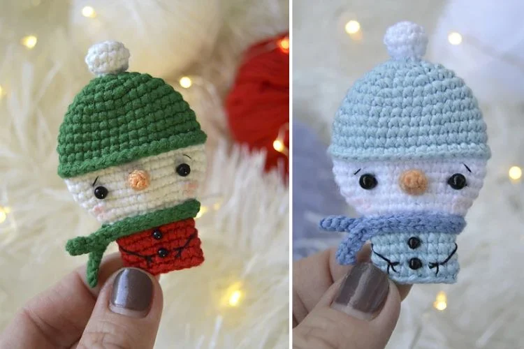 Two crocheted snowmen with hats and scarves.