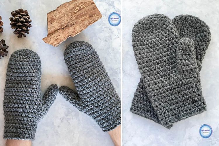 A pair of grey crocheted mittens with pine cones and pine needles.