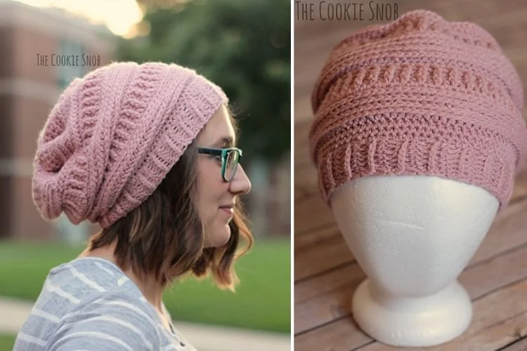 A mannequin wearing a pink crocheted hat.