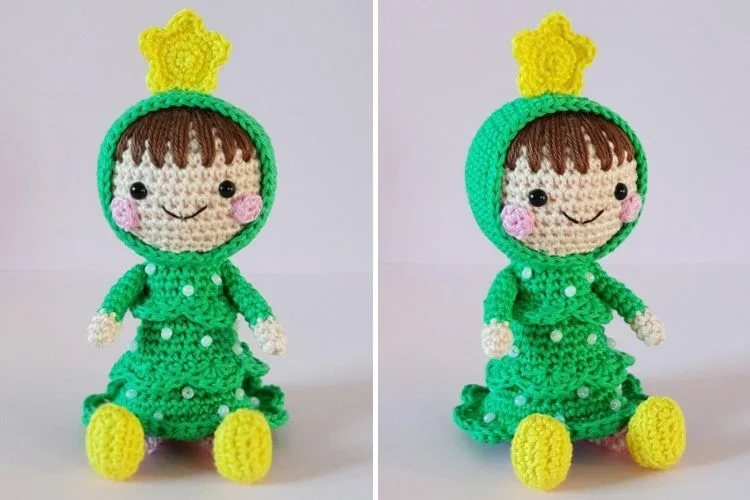 A crocheted doll in a green dress with a crown.