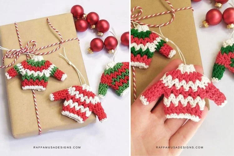 A pair of crocheted sweater ornaments on a gift box.