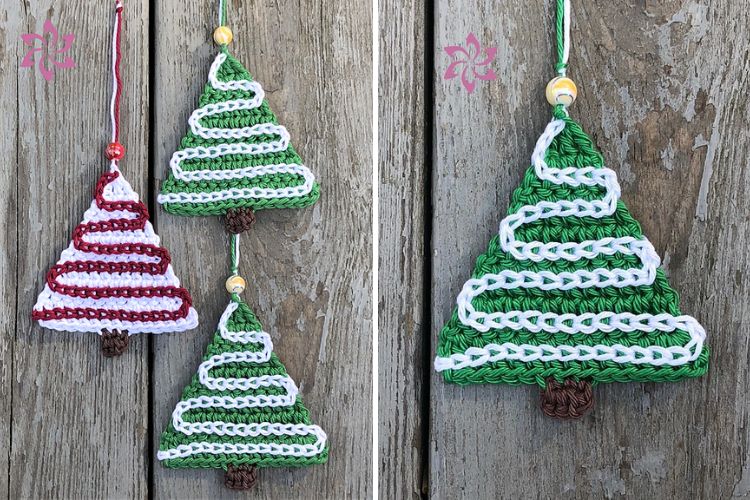 Three crocheted christmas tree ornaments hanging on a wooden fence.