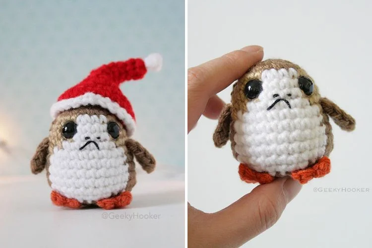 A crocheted penguin wearing a santa hat.