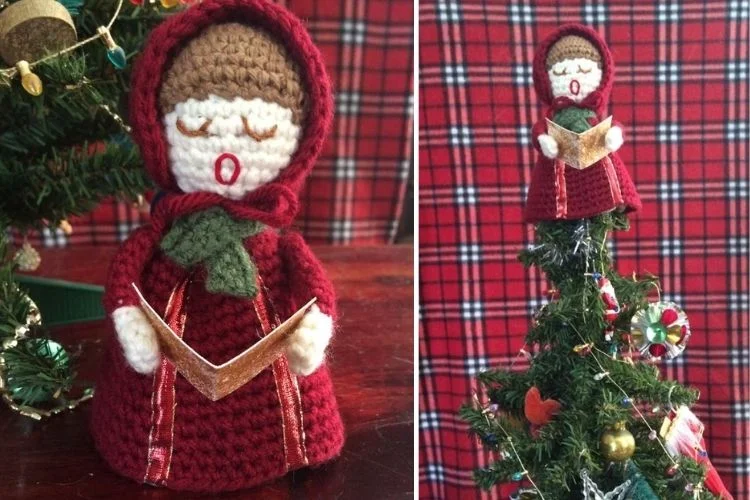 A crocheted christmas tree with a doll in a red coat.