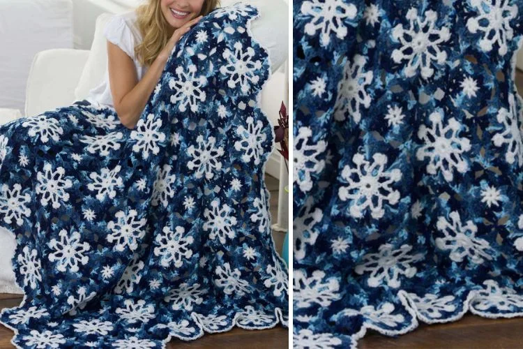 A woman is holding a blue and white crocheted snowflake blanket.