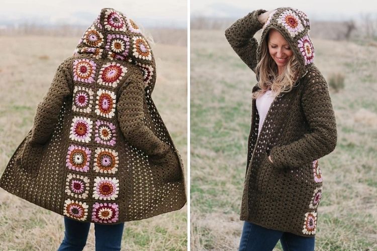 A woman wearing a crocheted coat in a field.