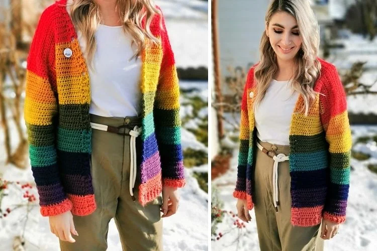 A woman wearing a rainbow colored cardigan in the snow.