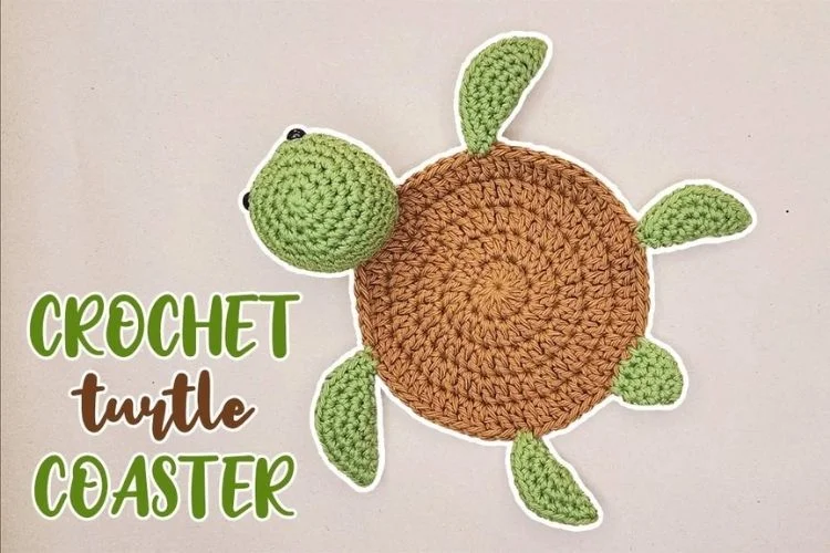 A crochet turtle coaster with the words crochet turtle coaster.