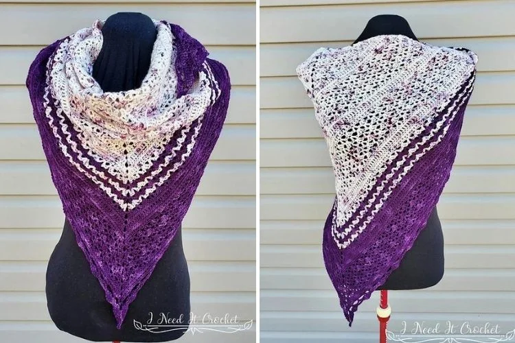 A purple and white shawl on a mannequin.